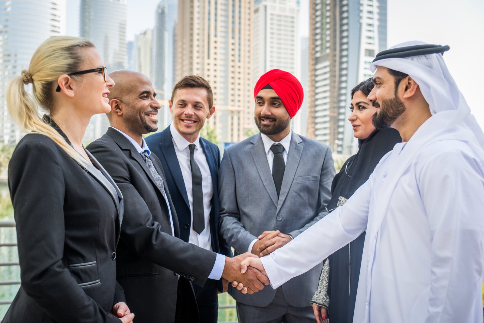 Business team in Dubai. Multicultural business people meeting and talking about business - Multiracial business team meeting