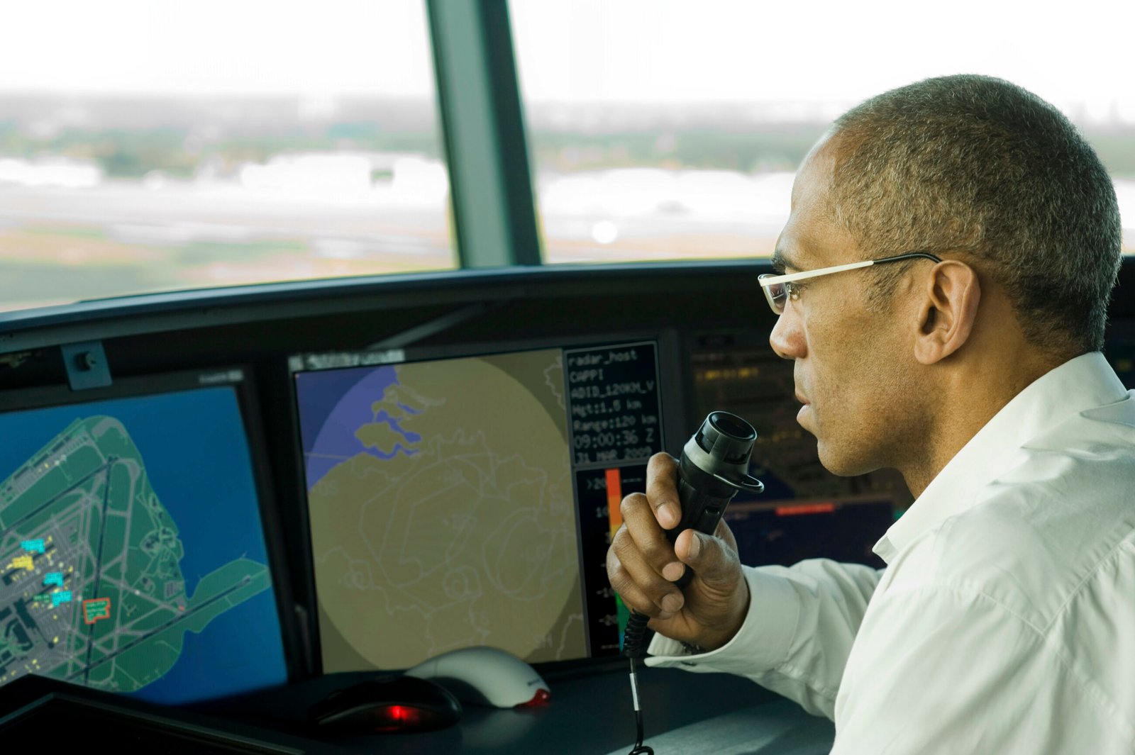 man working on airport control tower. HR Compliance