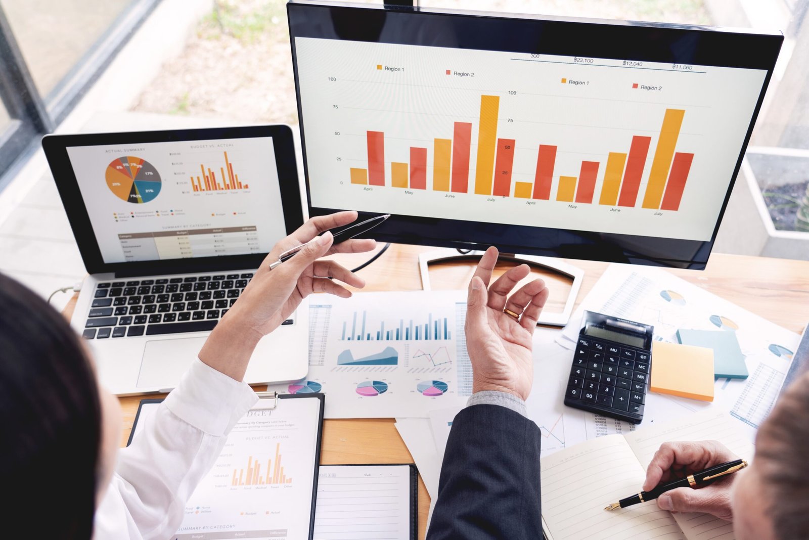 businessmen discussing project at meeting pointing explaining his idea charts and graph colleague at work having a meeting for project discussion.. Predictive workforce planning