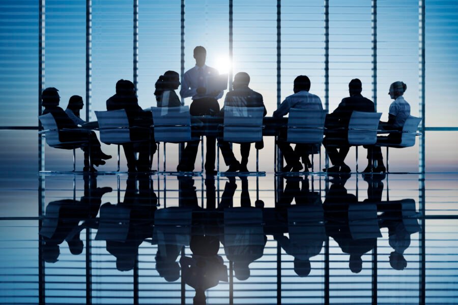 Business people in a board room meeting. Board-Level Internal Investigation