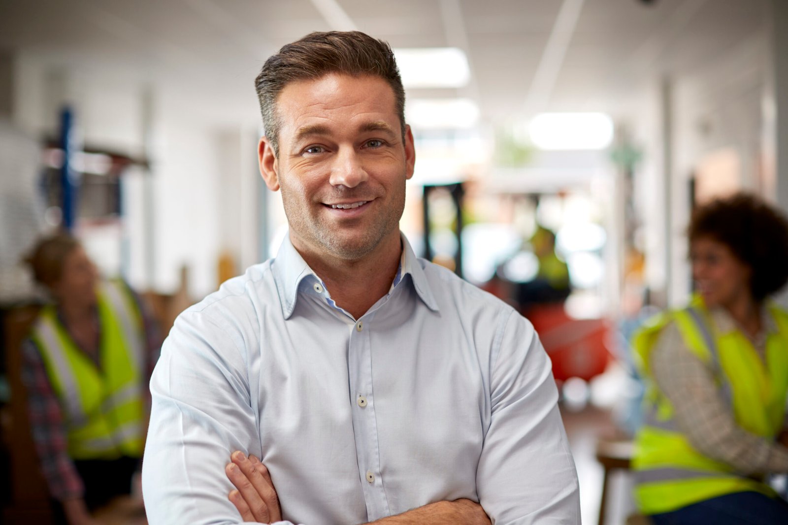 Portrait of a logistics and distribution manager standing confidently in a warehouse environment. Legal terminations in Malta.