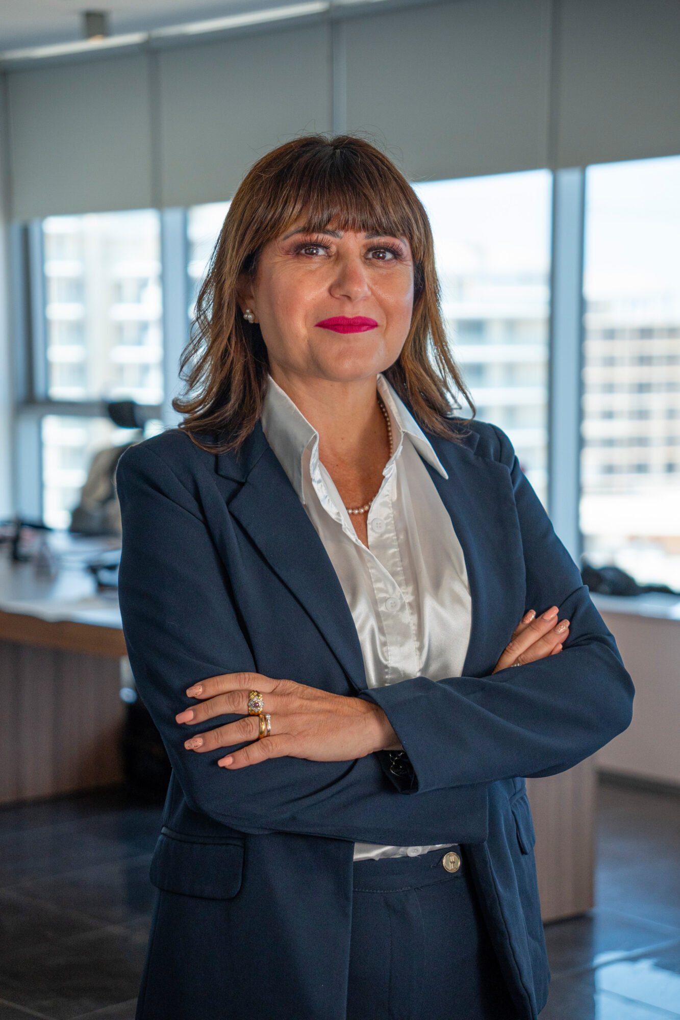 Portrait of a Giovanna Mirabile in a corporate office.