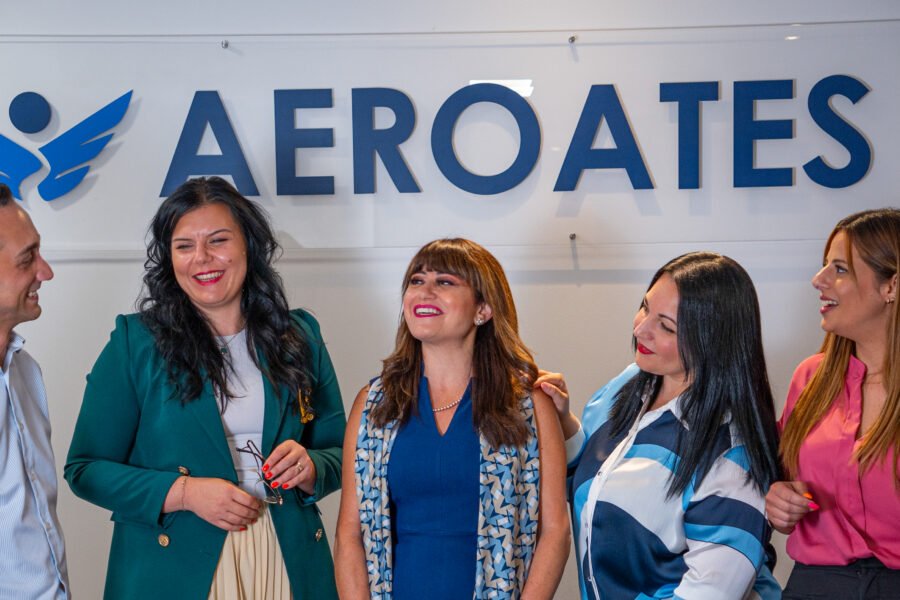 The Aeroates team posing together in their office.